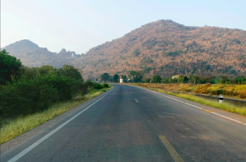 A premium SUV cab driving on the highway from Hyderabad to Srisailam.